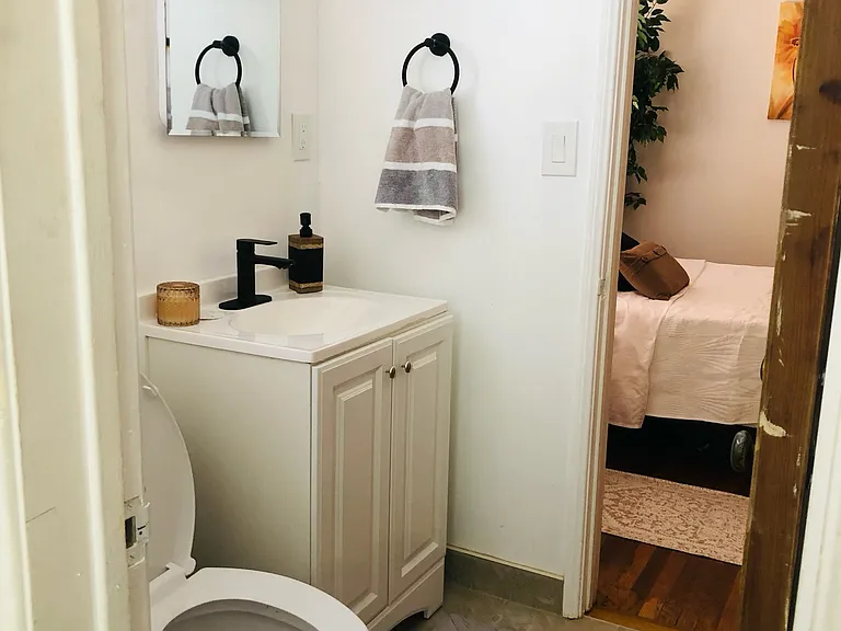 Newly refurbished bathroom with shower. Bathroom accessible to Bed #1 and Bed # 2.