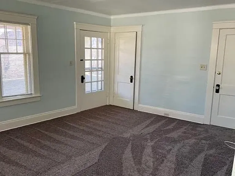 Living room closet main entrance and door to wonderful 2nd floor porch. Great for those evenings outside