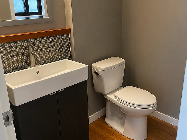 Half bath upstairs off the kitchen.