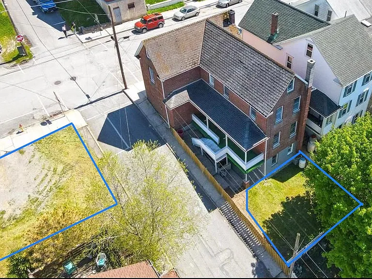 Lovely fenced-in yard, and separate off-street parking on this solidly-built brick detached single family home!