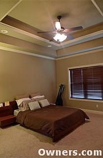 Master bedroom with coffered ceilings