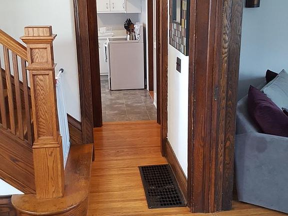 entry hallway view towards kitchen and living room