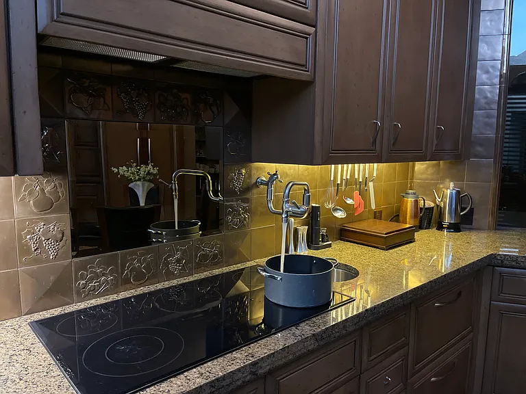 Pot filler at 5 burner glass cook top