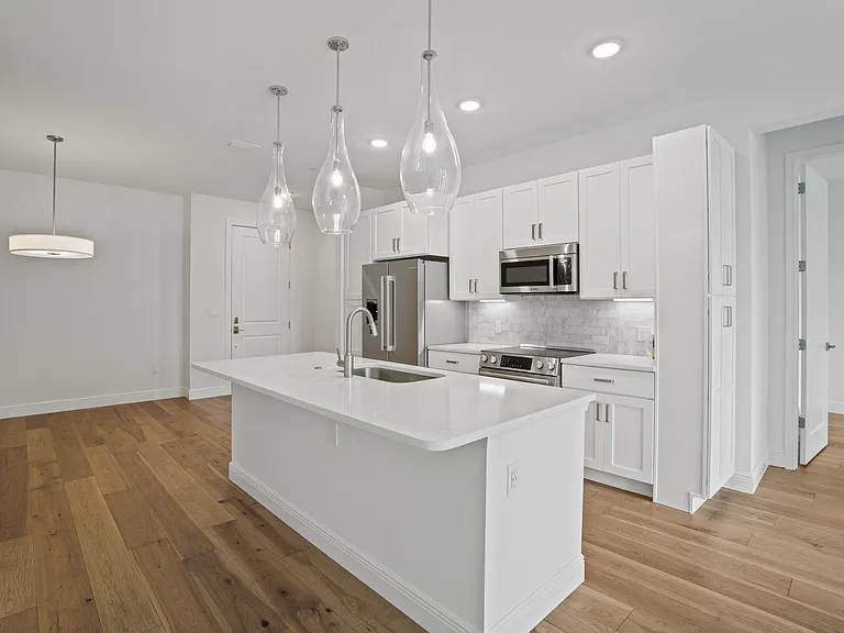 Open concept living, dining, and kitchen area, perfect for entertaining and everyday family living.