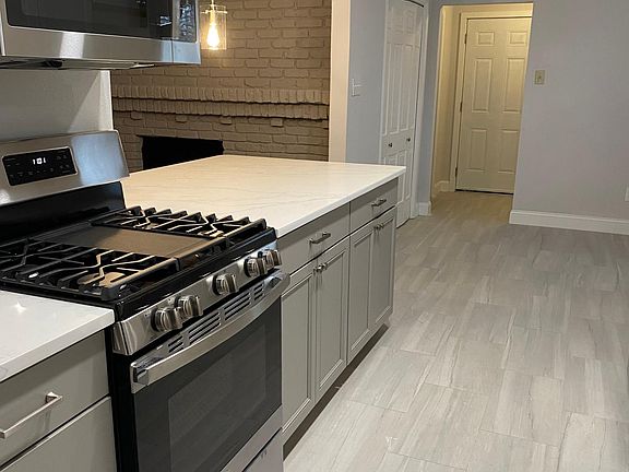 New cabinets, flooring, appliances and gas cooktop