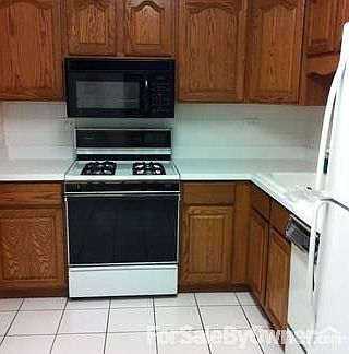 Kitchen
						:
						Includes all appliances, oak cabinets, roll out drawers, tile floor, backsplash