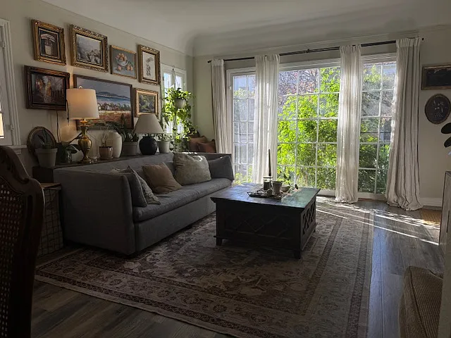 LIVING ROOM LOOKING INTO FRENCH WINDOWS