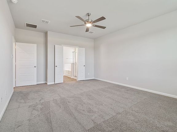 REPRESENTATIVE PHOTO - Primary bedroom in the Masters home plan by Trophy Signature Homes