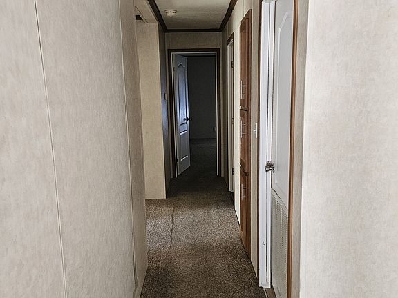 hallway to bathrooms and bedrooms