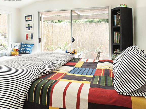 Bedroom with doors to outside.