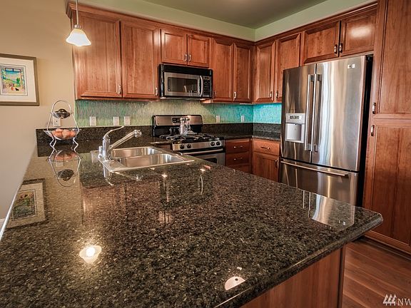 Plenty of cabinet space as well as great work space! All stainless steel appliances stay!