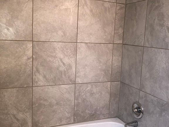 New Tiled shower new tub and fixtures