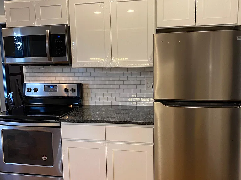 Brand new kitchen cabinets, granite countertops, and appliances