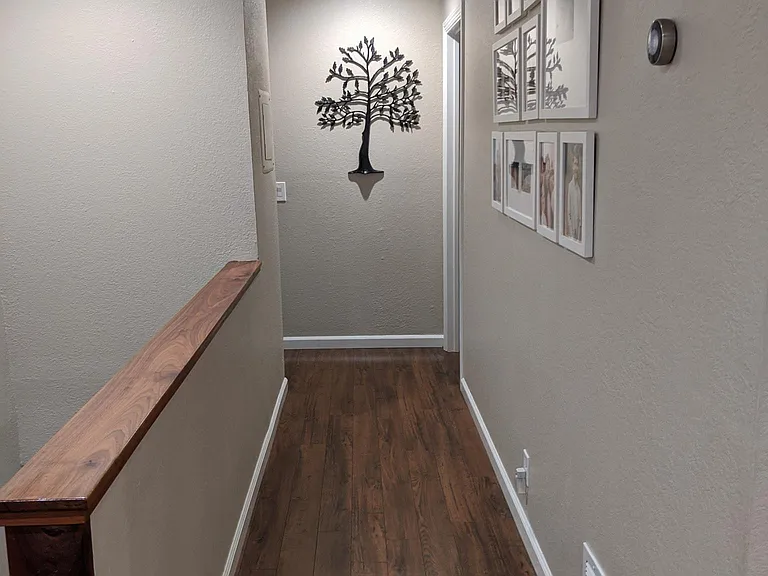 View down hallway. Master bedroom and master bath are on the right. The second bathroom and second bathroom are on the left. Third bedroom is directly behind the photographer.