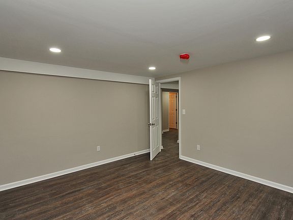 Living room with view of bedroom door