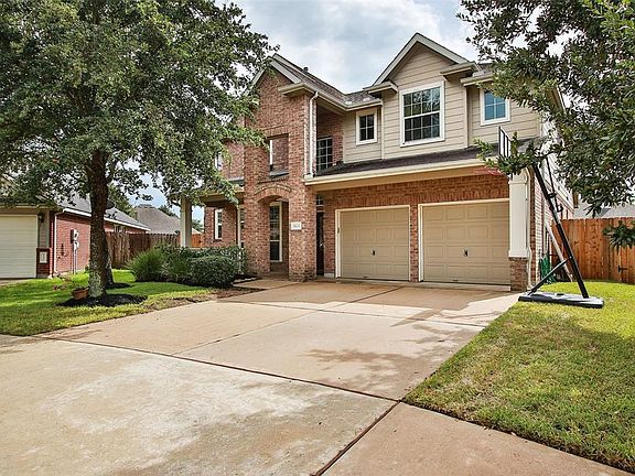 Double wide driveway to two car garage. Mature trees for that extra shade and new fence recently installed.
