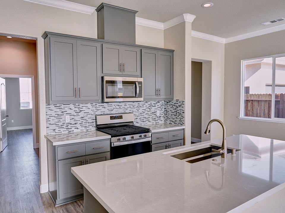 Kitchen with painted gray cabinets