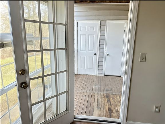 Entryway with glass doors and natural light