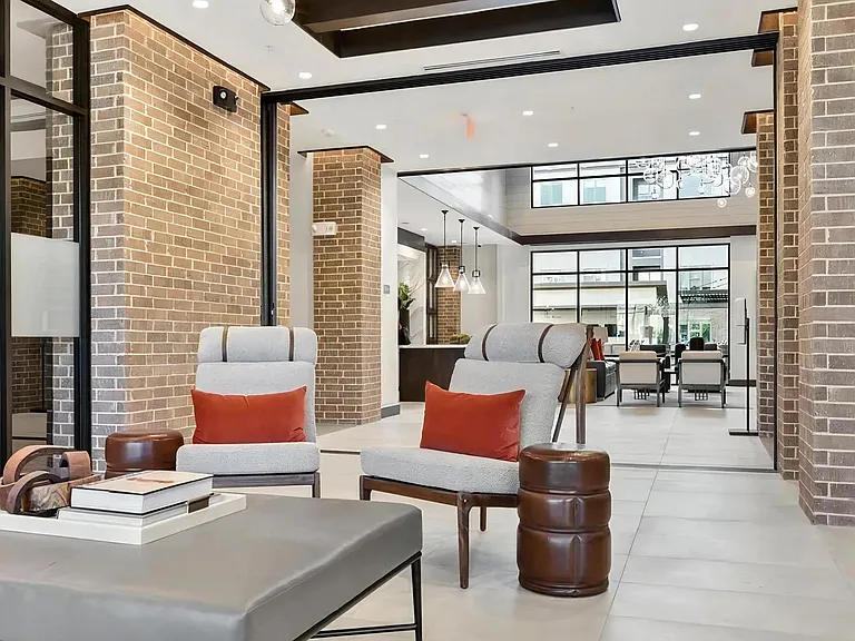 Comfortable Clubhouse Lounge with Natural Light and Courtyard Access
