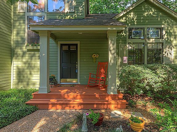 This Life Form home with earth tone paint color is perfectly suited for the lush native landscape.