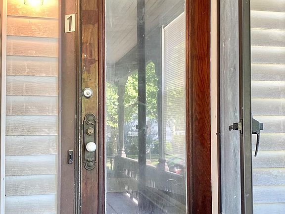 Front door off shared, covered porch