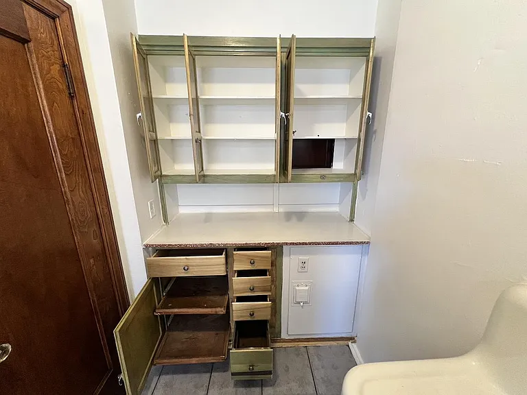 Original and beautifully restored built-in cabinetry.