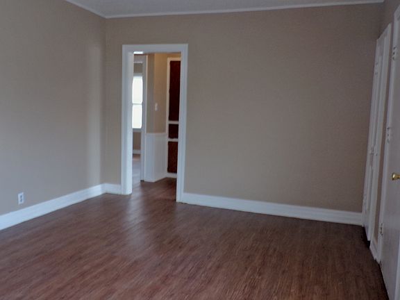 Living room leading to 2 of the bedrooms past the large line