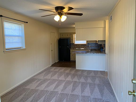 Newly painted with brand new Mohawk carpet, includes new ceiling fans, curtain rods and new blinds throughout.