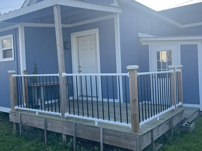 Rear Elevation, Back Porch and fenced area for pet.