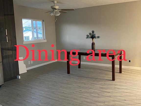 Dining Area with lots of kitchen cabinets and kitchen pantry.