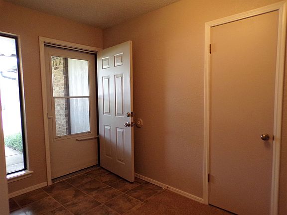 Large front entry is bright and cheery. It features a coat c