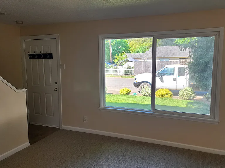 Front Room with picture window from kitchen nook