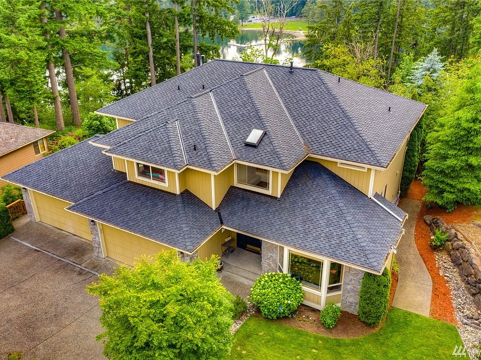 Great roof lines on the new 50-year roof are just the beginning to the appeal of this Curtis Lang built home.