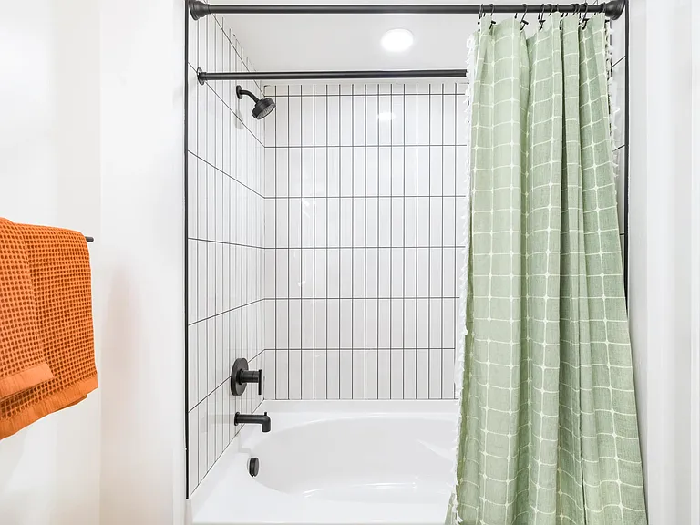 Clean lines, modern tile, and sleek finishes make every bathroom feel like a fresh start to your day.