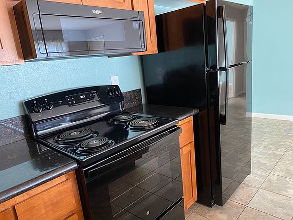 Matching refrigerator, range, and microwave (dishwasher not pictured)