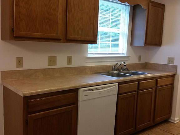 Kitchen with vaulted ceilings, ceramic tile floors and pantr