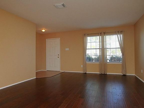 EXPERIENCE THE RICH ENVIRONMENT AS SOON AS YOU STEP INSIDE THE ENTRYWAY.  THE INTERIOR WAS FRESHLY PAINTED IN OCT 2012 WITH A NEUTRAL TAN HUE TO COMPLEMENT ANY DECOR, WIITH 2" FAUX WOOD BLINDS AND GLEAMING HARDWOOD, WIDE-PLANK HAND SCRAPED FLOORS.