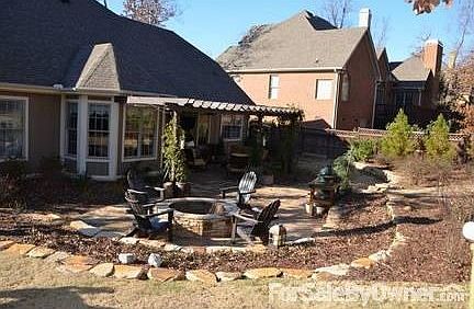 Large Beautifully Stained-Fence Backyard
						:
						Features stone patio, large fire pit, covered pergola.