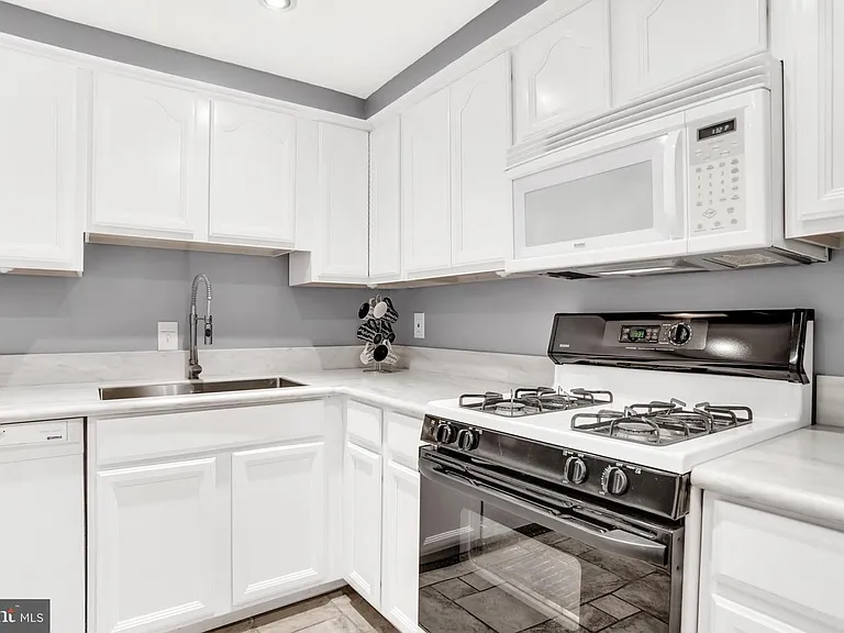 Kitchen with gas stove.