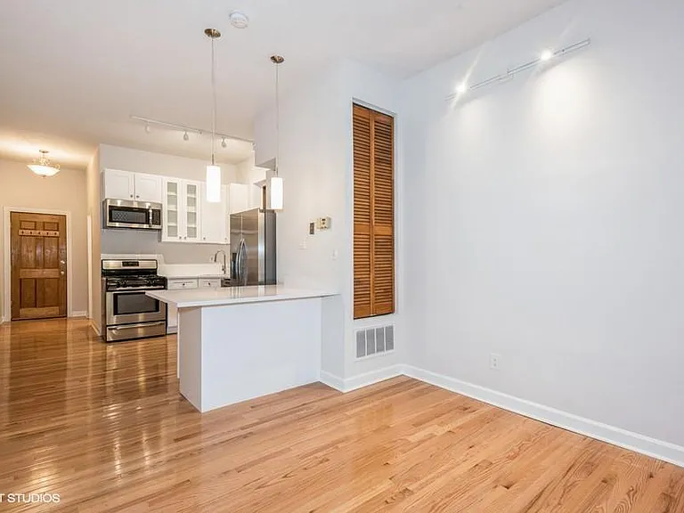 Large living, dining and kitchen area