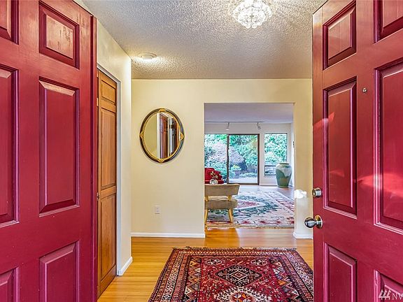 Bamboo hardwood floors and abundant natural light greet you upon entry. 