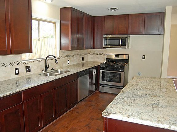 Granite Counters, SS appliances, SS sink with Gooseneck faucet.