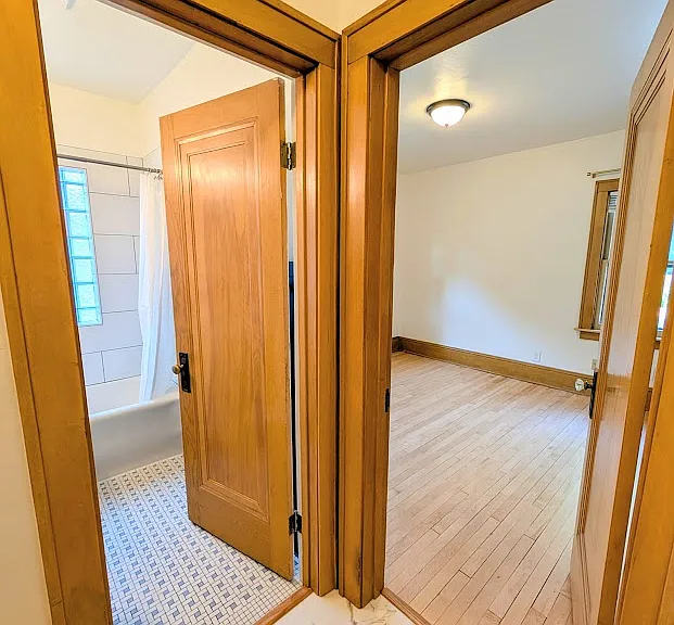 [LOWER UNIT]: leading into second bedroom