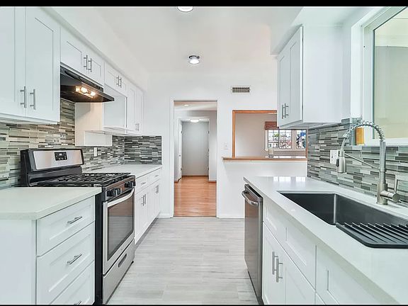 New kitchen completely updated in 2024. New cabinets, quartz counter tops and tile floor