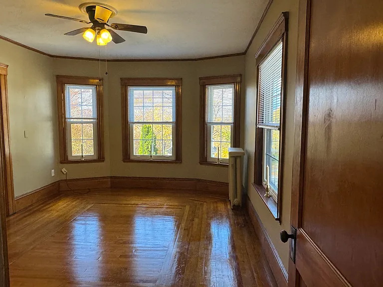 This living room is partially open to the dining room. On sunny days, it's flooded with sunlight!