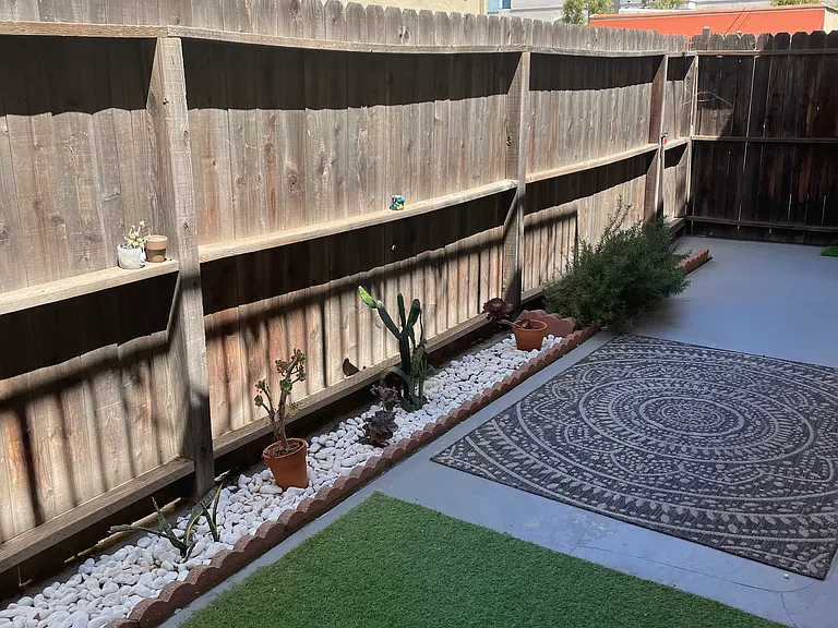 Unit 11 super large private patio with dirt or rock plantar