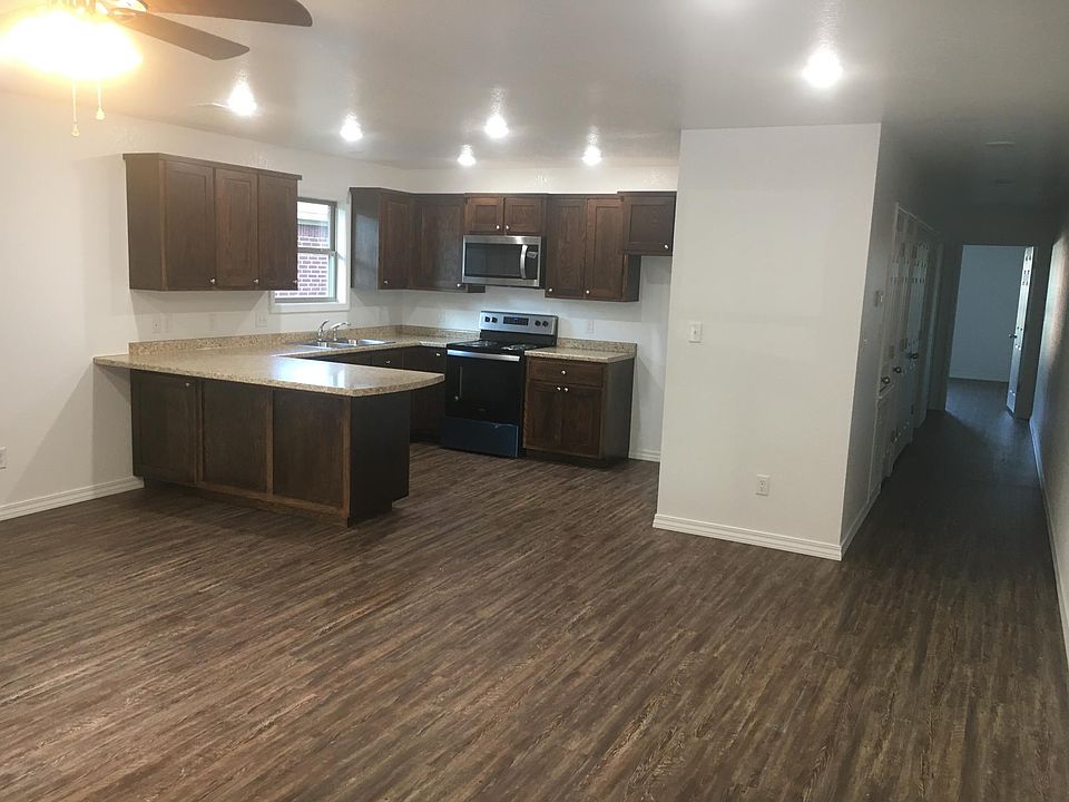open kitchen area to living room & will have refrigerator