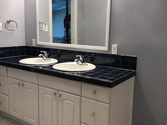 Master Bath: Tiled floor, double vanity sinks, lots of storage