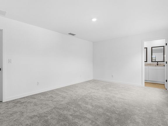 Unwind after a long day in the master bedroom