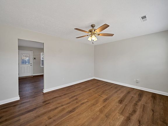 Living area leading into kitchen
